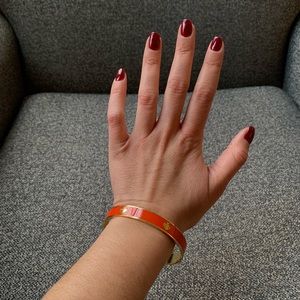 Orange Kate Spade bangle bracelet
